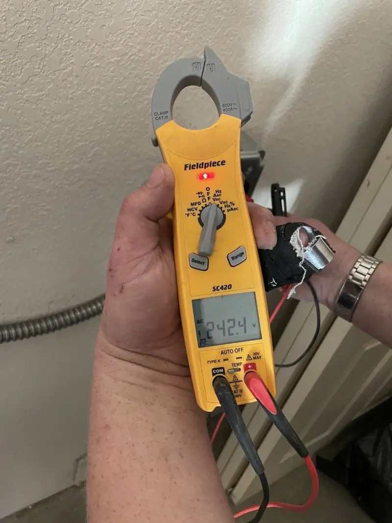 Voltage testing with clamp meter during Ceiling Fan Installation in Watertown